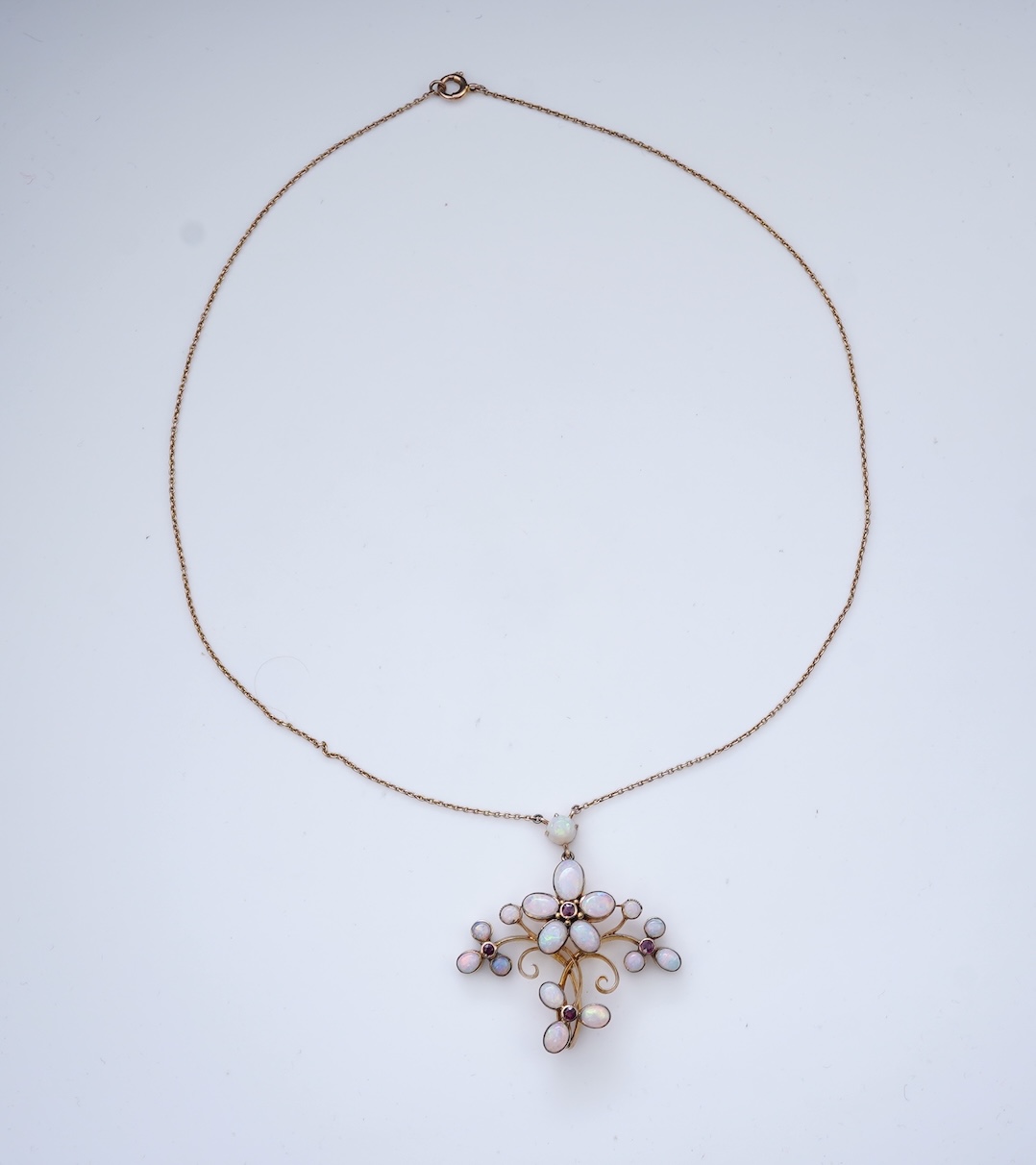 An opal and garnet pendant necklace, circa 1900